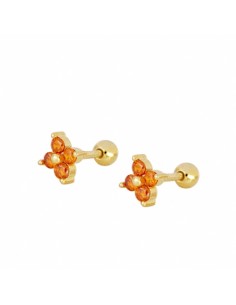 Piercing flor de cuatro pétalos de circonita naranja. Piercing de plata con baño de oro, cierre bola con rosca.