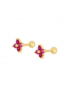 Piercing flor de cuatro pétalos de circonita magenta. Piercing de plata con baño de oro, cierre bola con rosca.