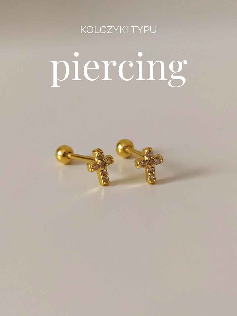 Kolczyki typu piercing. Małe krzyżyki z białymi cyrkoniami.